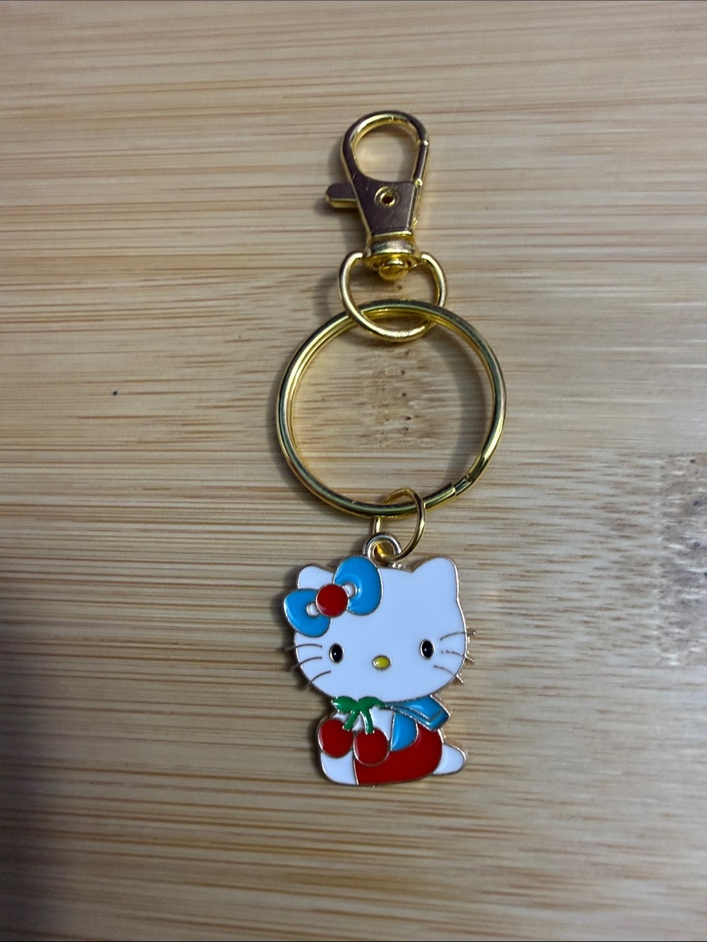 Sanrio Hello Kitty Enamel Keychain - White, Blue, Red, Gold